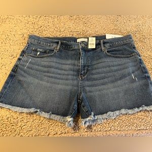LOFT brand new  mid rise distressed denim shorts with fringed hem.